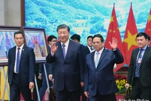 El primer ministro de Vietnam, Pham Minh Chinh (derecha), y el secretario general del Partido Comunista de China y presidente del país vecino, Xi Jinping. (Fotografía: Nhan Dan)