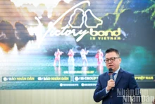 Le Quoc Minh, miembro del Comité Central del Partido, presidente-editor de Nhan Dan, subjefe de la Comisión de Propaganda y Movilización de Masas del Comité Central del Partido y titular de la Asociación de Periodistas del país, da palabras. (Fotografía: Nhan Dan)