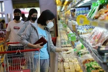 Las ventas minoristas totales de bienes y servicios de consumo en Vietnam de enero a julio se estimaron en 153,43 mil millones de dólares, un aumento del 10,4 por ciento respecto al mismo período del año anterior. (Fotografía: VNA)