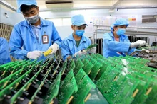 Línea de producción de medidores electrónicos. (Fotografía: VNA)