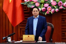 El primer ministro Pham Minh Chinh interviene en la reunión. (Fotografía: Nhan Dan)