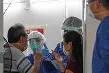 Un sitio de prueba de detección de Covid-19 en Singapur. (Fotografía: VNA)