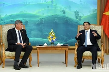 El primer ministro de Vietnam, Pham Minh Chinh (izquierda), se reúne con el ministro-presidente de Flandes, Jan Jambon. (Fotografía: Nhan Dan)
