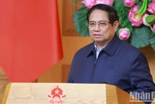 El primer ministro de Vietnam, Pham Minh Chinh, preside la reunión. (Fotografía: Nhan Dan)