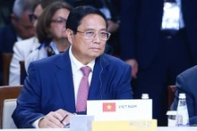 El primer ministro de Vietnam, Pham Minh Chinh, participa en la Cumbre del grupo ampliado de los BRICS. (Fotografía: VNA)