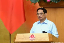 El primer ministro Pham Minh Chinh interviene en el simposio. (Fotografía: Nhan Dan)