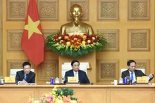 El primer ministro de Vietnam, Pham Minh Chinh (centro), en el coloquio. (Fotografía: Nhan Dan)