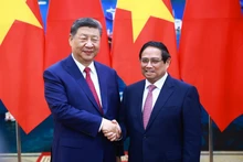 El primer ministro de Vietnam, Pham Minh Chinh (derecha), y el secretario general del Partido Comunista y presidente de China, Xi Jinping. (Fotografía: Nhan Dan)