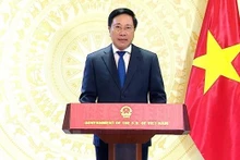 El vice primer ministro permanente de Vietnam, Pham Binh Minh, interviene en el acto. (Fotografía: VNA)