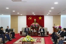 En la reunión entre Vo Van Minh y Charles R. Kaye. (Fotografía: VNA)