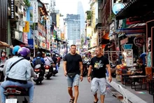 Turistas extranjeros en Ciudad Ho Chi Minh. (Fotografía: VNA)