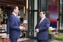 El primer ministro de Vietnam, Pham Minh Chinh (derecha), y el presidente de Indonesia, Joko Widodo. (Fotografía: VNA)