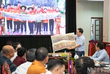 [Foto] Ejecutivos de prensa laosiana realizan visita de trabajo al periódico Nhan Dan