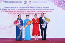 Las autoridades de Vietnam y Cuba en el evento. (Fotografía: VNA)