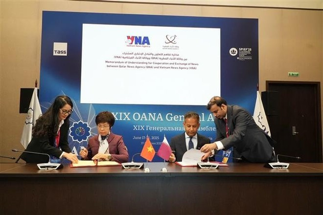 Ceremonia de firma del Memorando de Entendimiento sobre cooperación e intercambio entre la VNA y la QNA. (Foto: VNA) Ceremonia de firma del Memorando de Entendimiento sobre cooperación e intercambio entre la VNA y la QNA. (Foto: VNA)