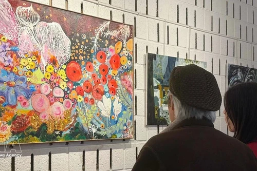 Visitantes en la exposición (Foto: VNA)