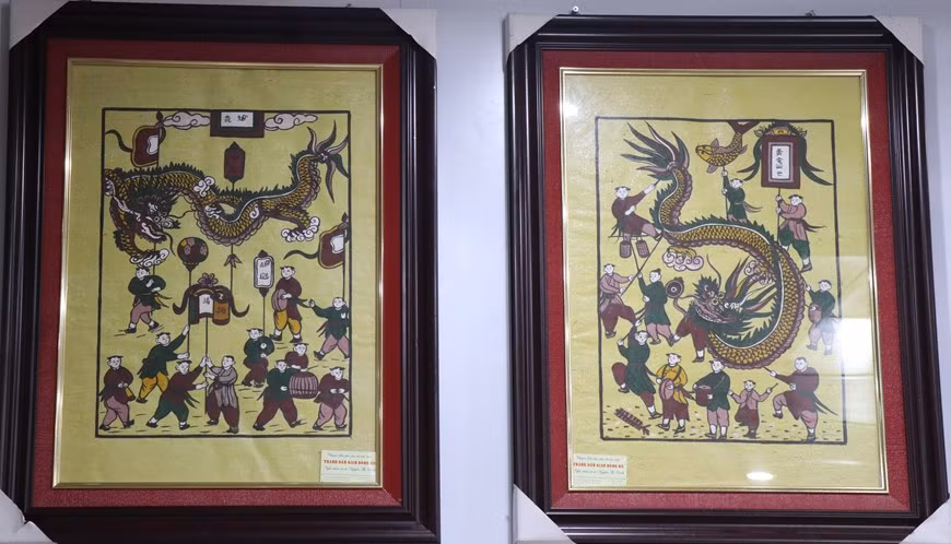 Pinturas de la antigua y nueva procesión de dragones. (Foto: VNA)