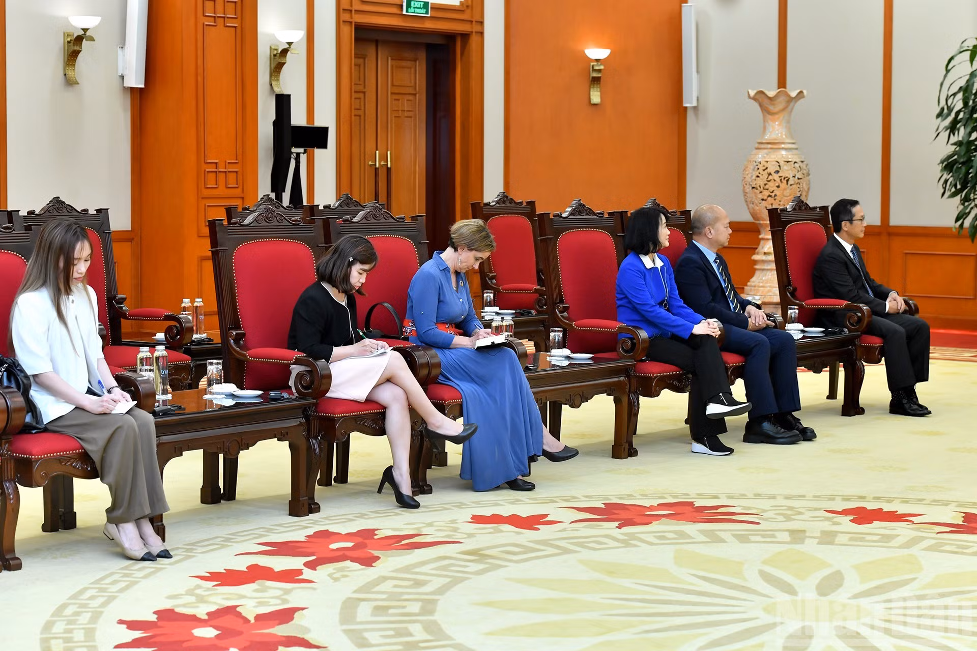 Delegados de la corporación Qualcomm a la recepción.