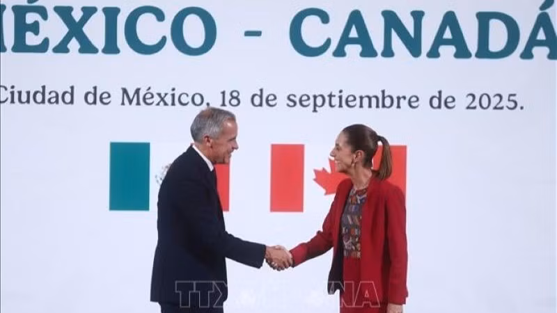 La presidenta mexicana, Claudia Sheinbaum (derecha), se reúne con el primer ministro canadiense, Mark Carney, durante su visita en México, el 18 de septiembre de 2025. (Foto: Xinhua/VNA)